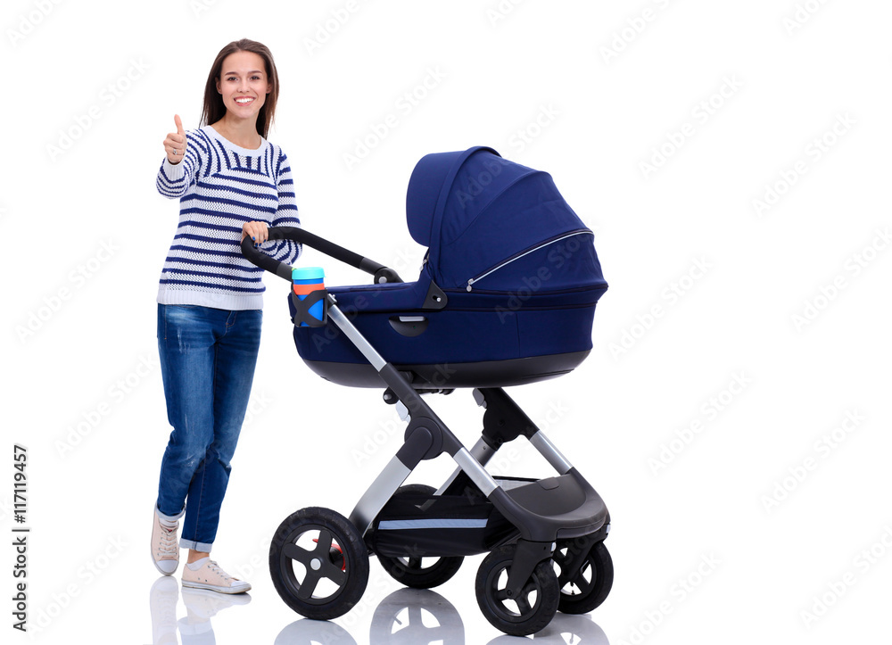 Full length portrait of a mother with a stroller showing ok, isolated on white background Full length portrait of a mother with a stroller showing ok, isolated on white background