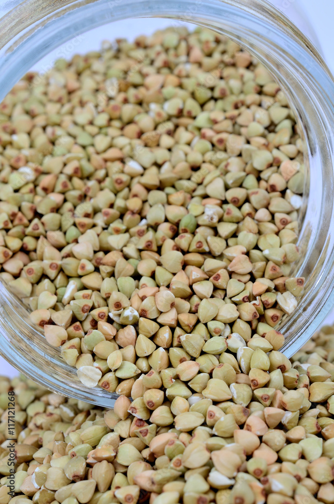 Obraz premium Jar with green buckwheat