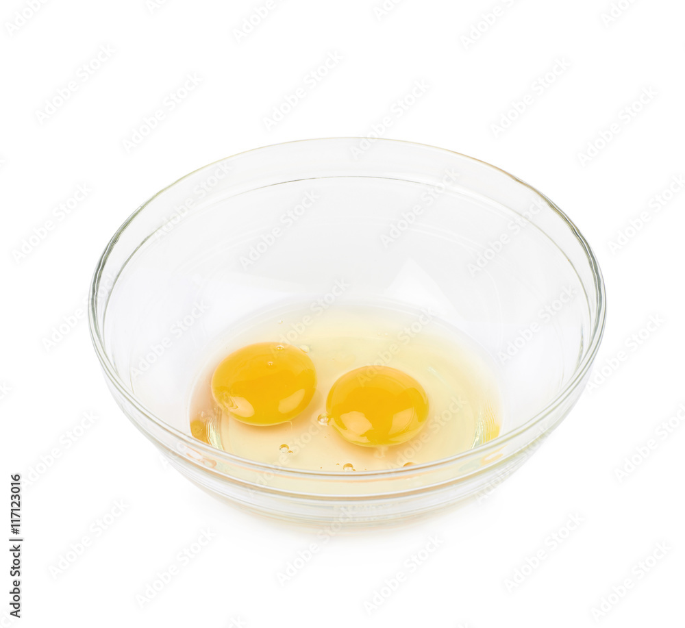Two cracked eggs in a bowl isolated Two cracked eggs in a bowl isolated