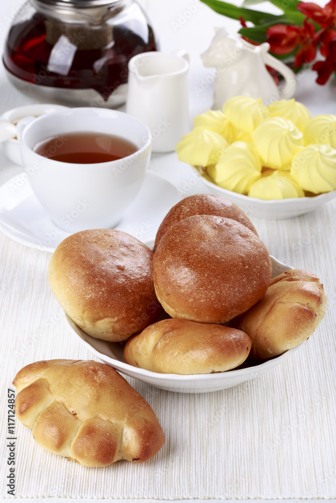 Tea party with buns and meringue cookies. Tea party with buns and meringue cookies.