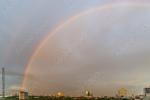Selective focus of rainbow over bangkok city in the evening