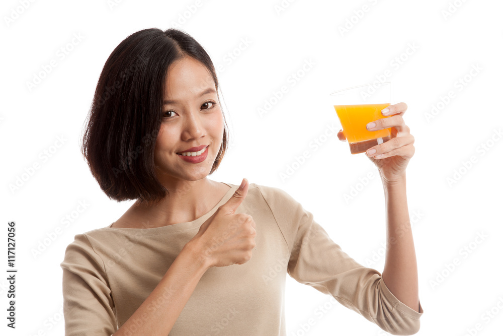 Young Asian woman thumbs up drink orange juice Young Asian woman thumbs up drink orange juice