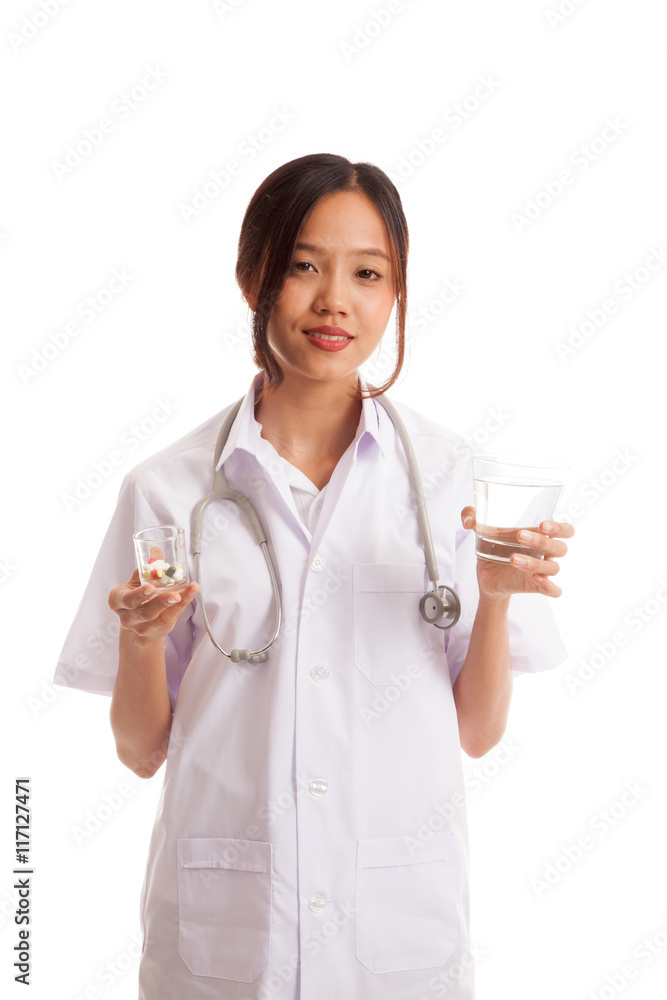 Young Asian female doctor with water and medicine
