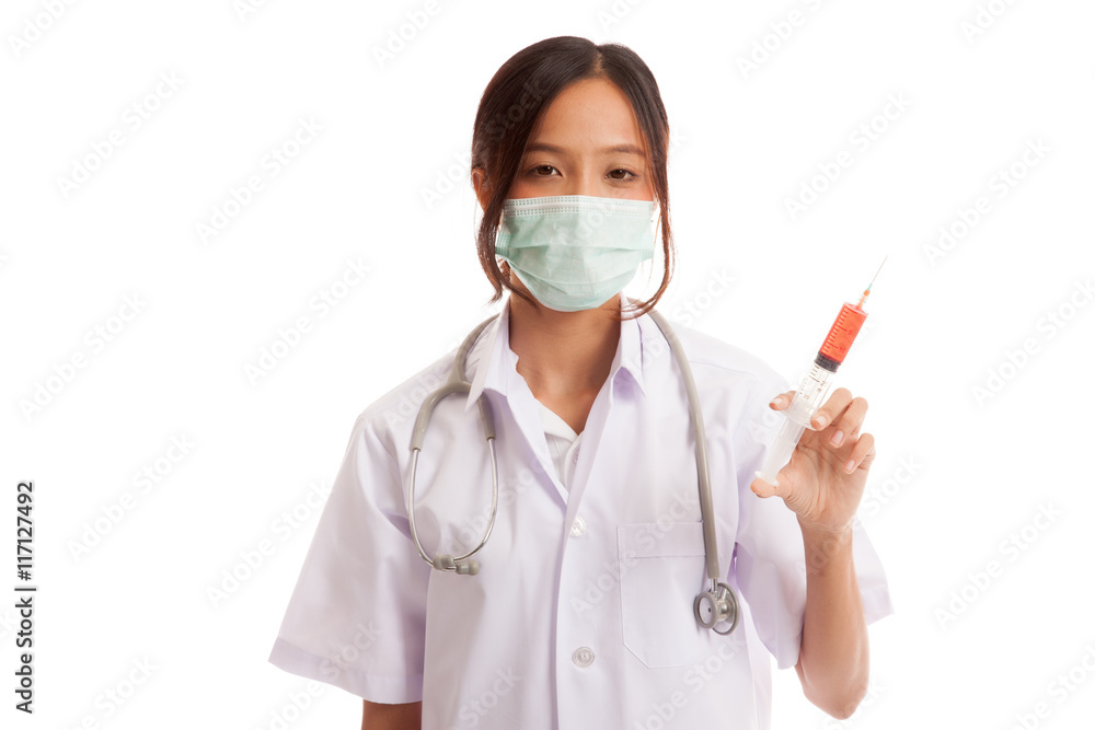 Young Asian female doctor with mask hold syringe Young Asian female doctor with mask hold syringe