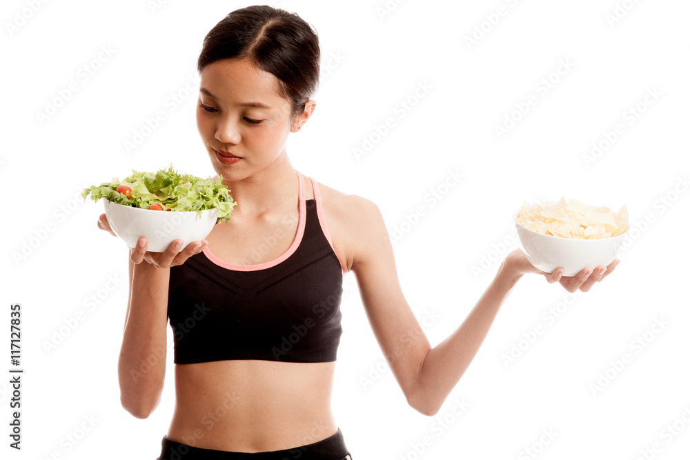Beautiful Asian healthy girl salad and potato chips Beautiful Asian healthy girl salad and potato chips