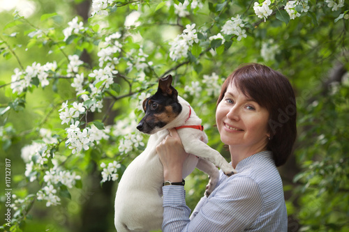 Portrait of happy twoman and dog Jack Russell photo