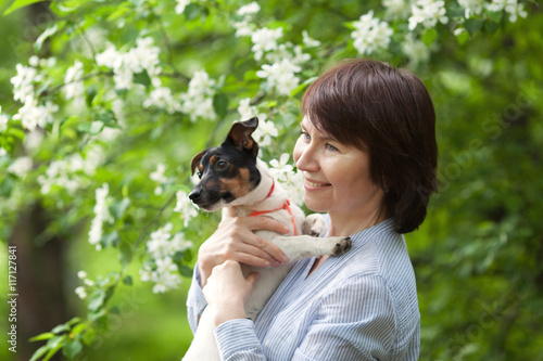 Portrait of happy twoman and dog Jack Russell photo