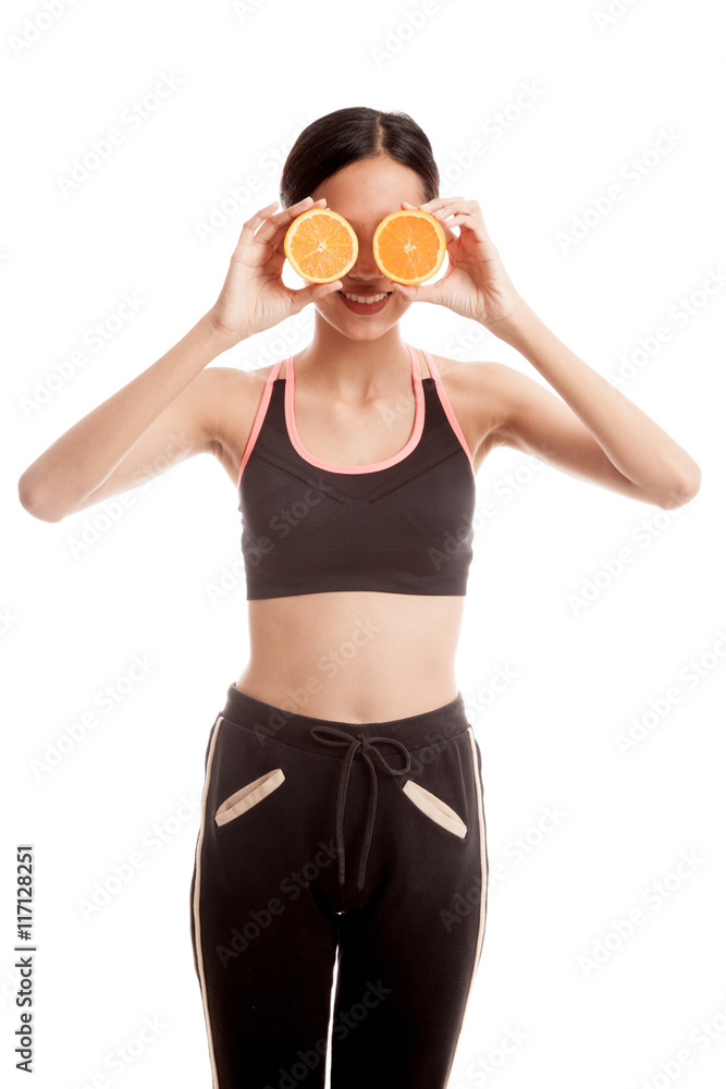 Beautiful Asian healthy girl with orange fruit over her eyes Beautiful Asian healthy girl with orange fruit over her eyes