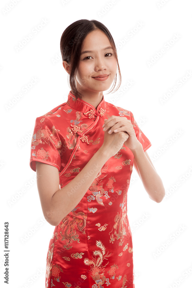 Asian girl in chinese cheongsam dress with gesture of congratula Asian girl in chinese cheongsam dress with gesture of congratula