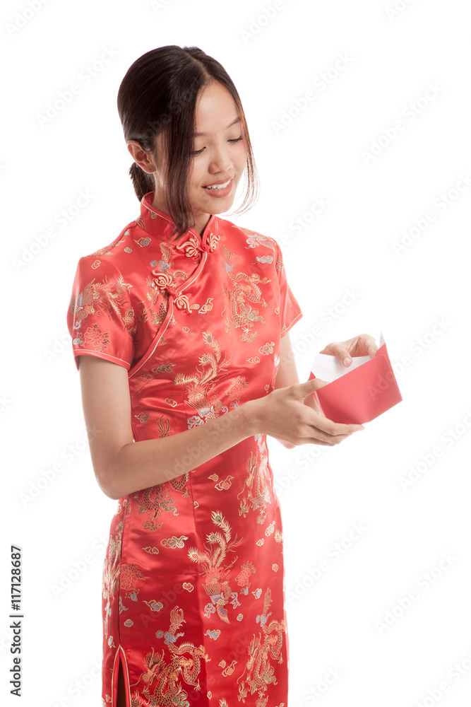 Asian girl in chinese cheongsam dress with red envelope Asian girl in chinese cheongsam dress with red envelope