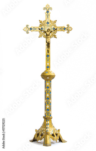 Antique gold cross on white background