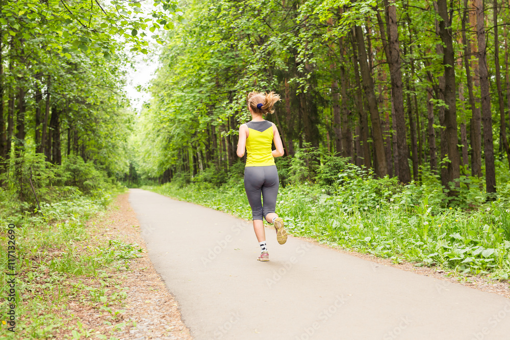 young fitness woman runner running on trail young fitness woman runner running on trail