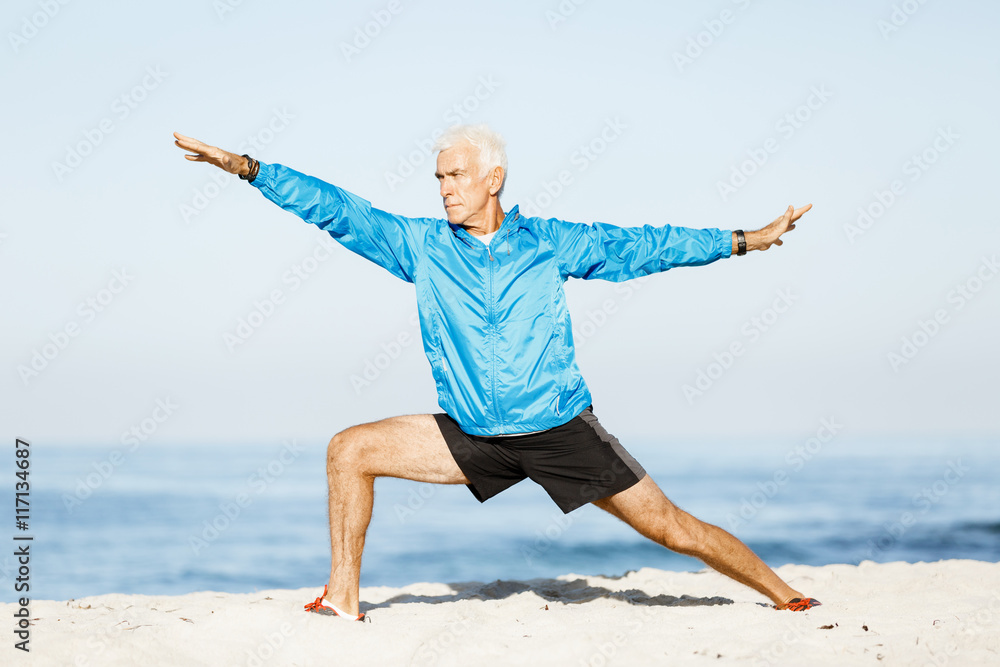 Man training on beach outside Man training on beach outside