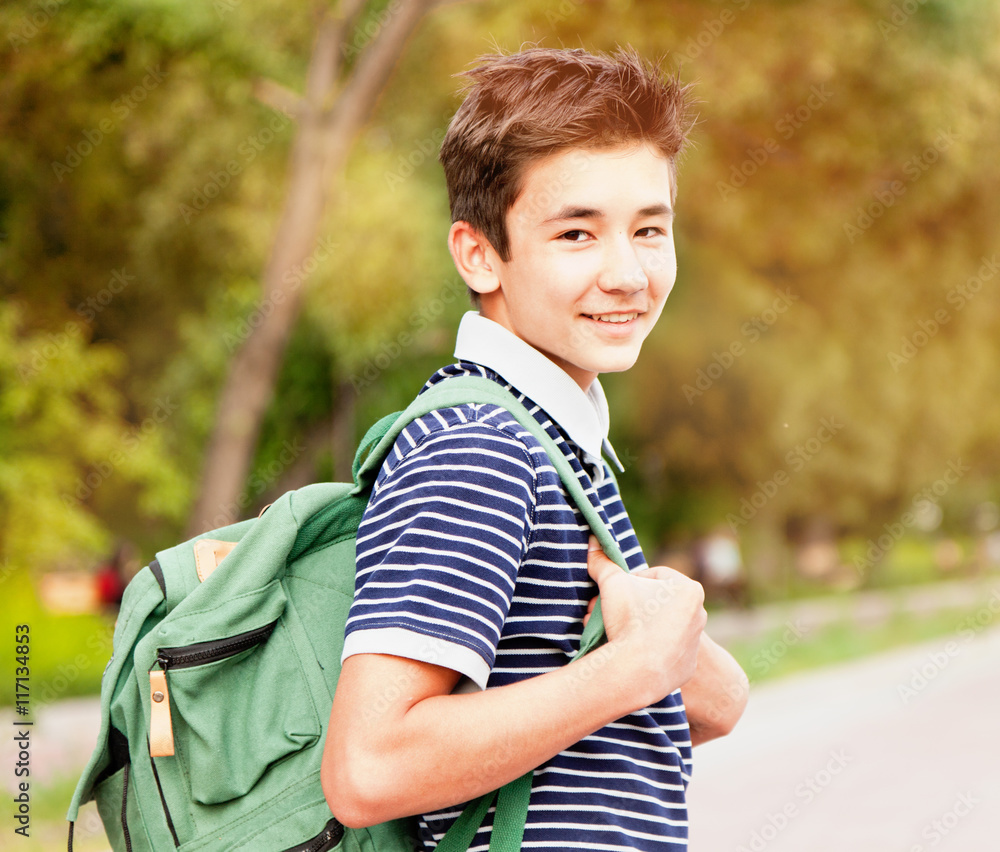 joyful boy teenager with backpack, outdoor. Back to school joyful boy teenager with backpack, outdoor. Back to school