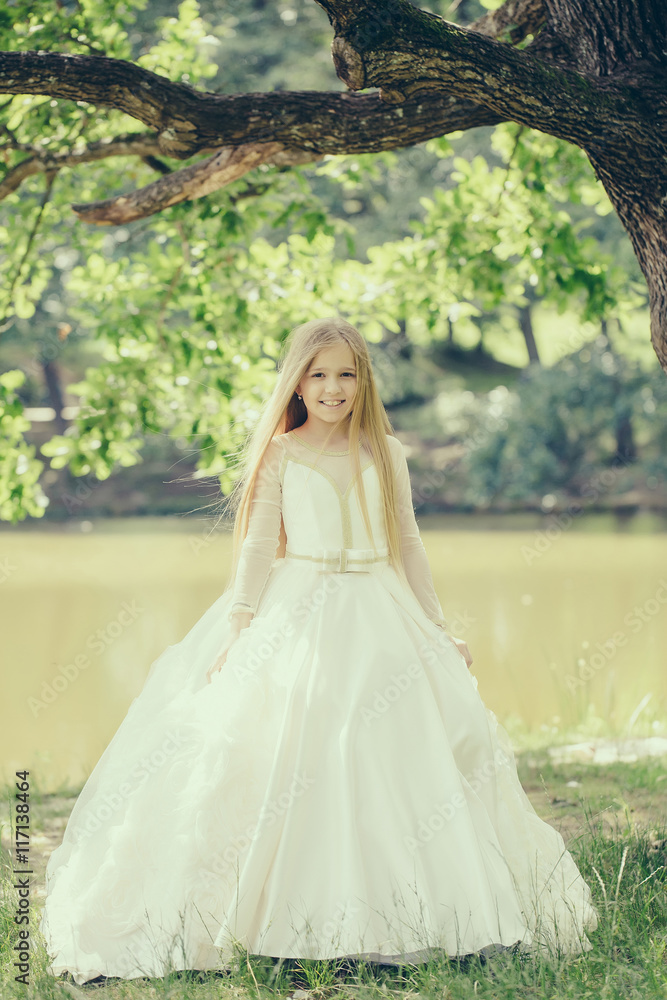 small girl in white dress outdoor