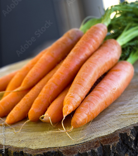 carrots bunch on rustic wooden background