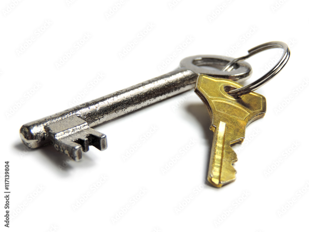 Key ring with silver and golden key, isolated on white background. Key ring with silver and golden key, isolated on white background.