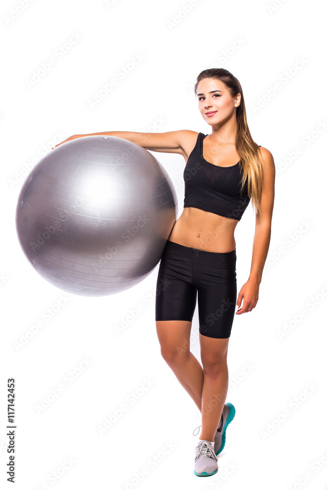 Woman making exercise with pilates ball, against white background Woman making exercise with pilates ball, against white background