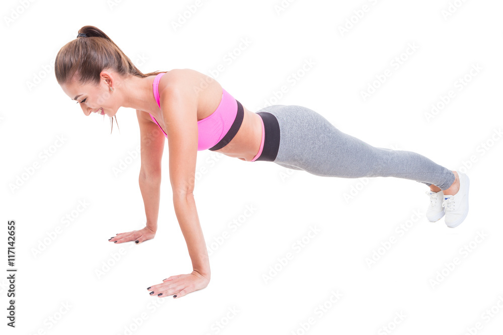 Young female doing push-ups for training