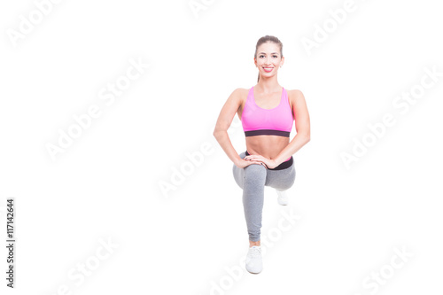 Female working out standing in lunge position