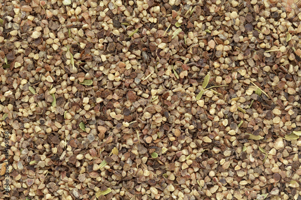 Organic Black pepper (Piper nigrum) peppercorns in big cut size. Macro close up background texture. Top view. Organic Black pepper (Piper nigrum) peppercorns in big cut size. Macro close up background texture. Top view.
