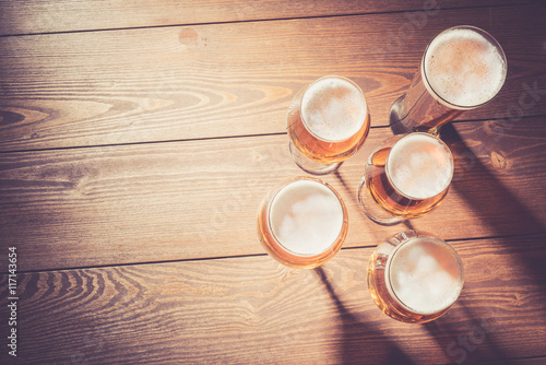 Beer glasses on wooden table