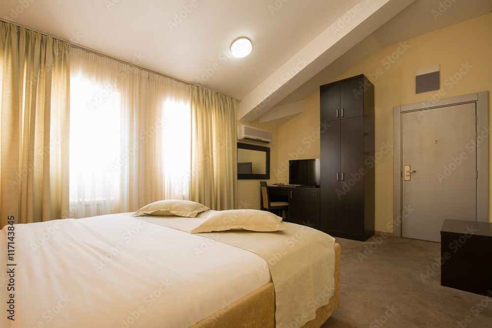 Fototapeta premium Modern elegant hotel bedroom interior