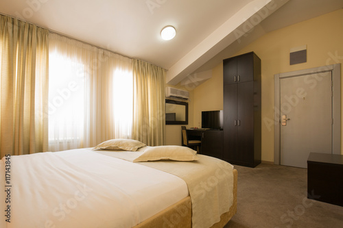 Modern elegant hotel bedroom interior © rilueda
