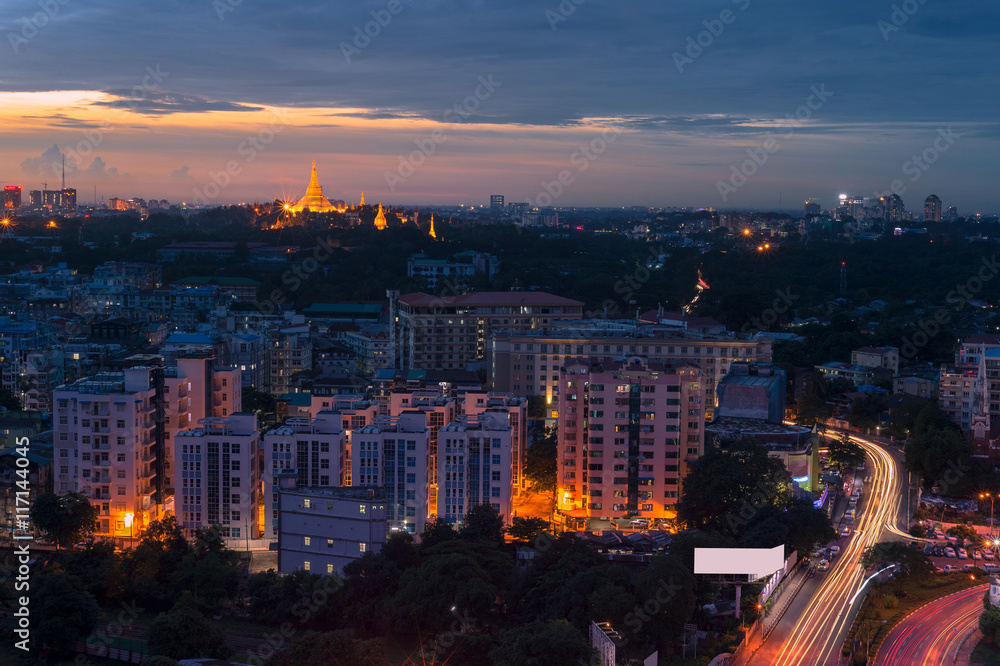Fototapeta premium Myanmar Pagoda at Night. A long exposure with beautiful blues sky and golden yellows pagoda.