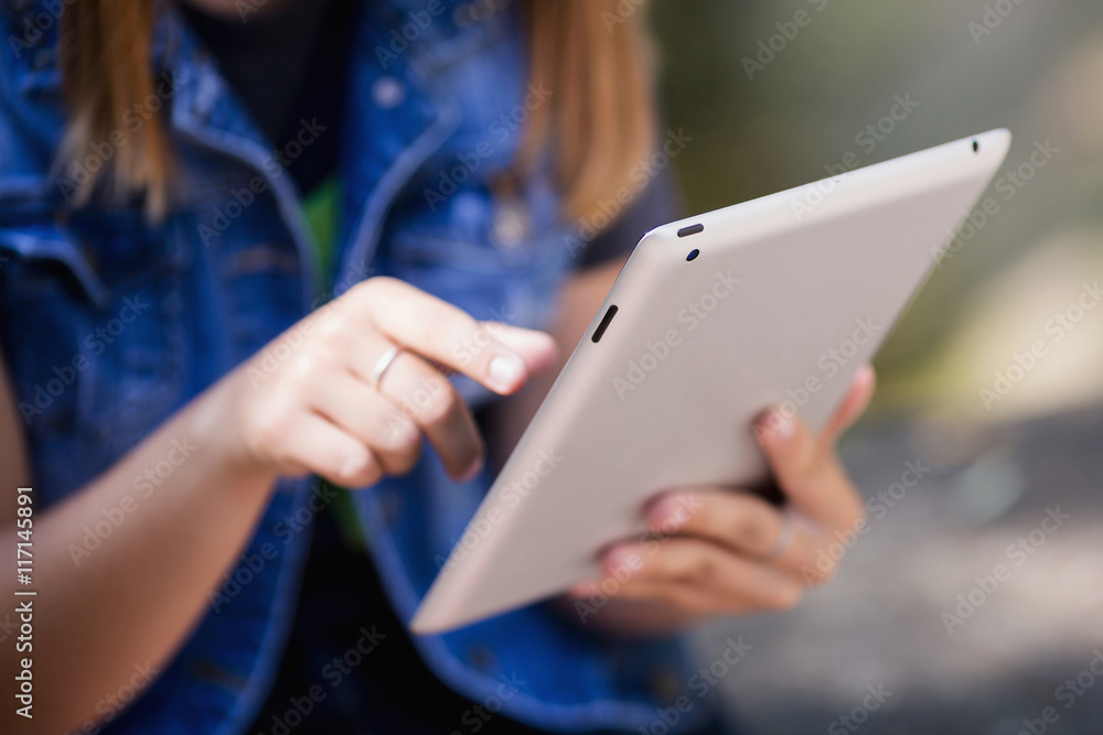 Female hands holding digital tablet. Doing business the modern w Female hands holding digital tablet. Doing business the modern w