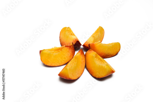 slices of ripe peach isolated on white background with shadow