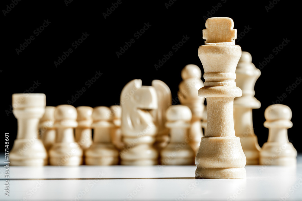 chess pieces on a black background