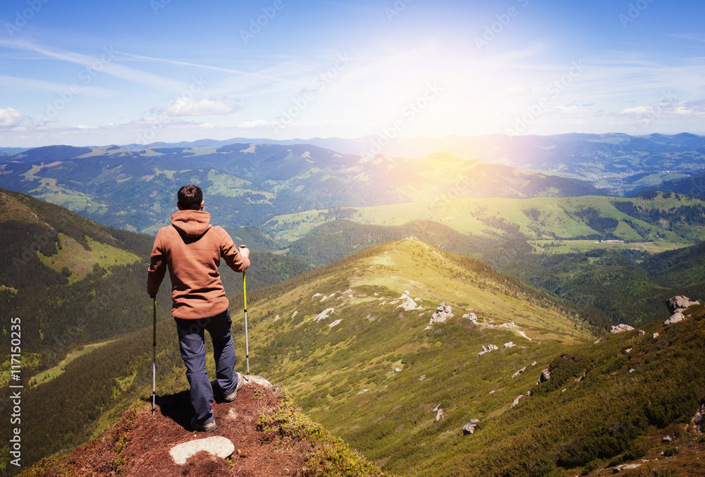 Man standing on the top of the mountain