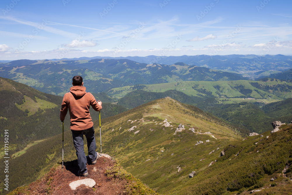 Man standing on the top of the mountain