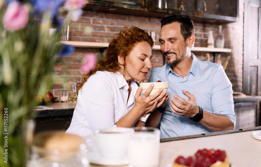 Woman holding bowl with strawberries Woman holding bowl with strawberries