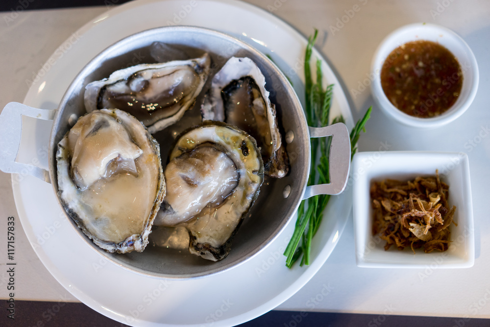 oysters on garnish with sauce oysters on garnish with sauce
