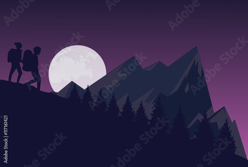 silhouette of two people hiking during the night dark sky in mountain down hill