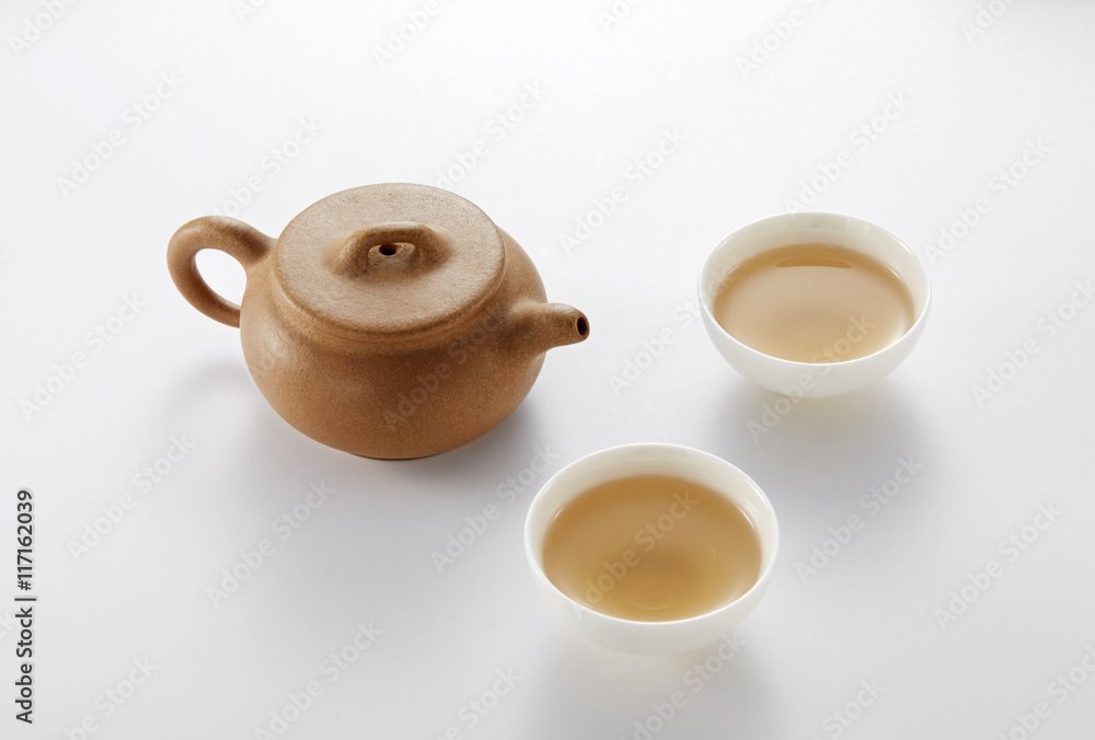 Chinese teapot and cups on white background