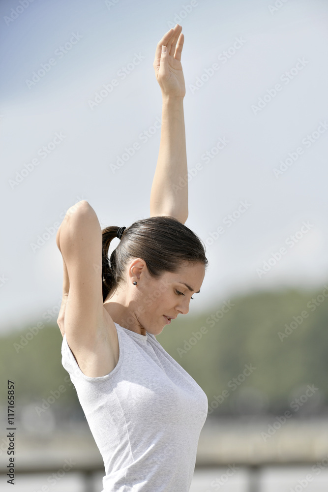 Fitness girl stretching after running Fitness girl stretching after running