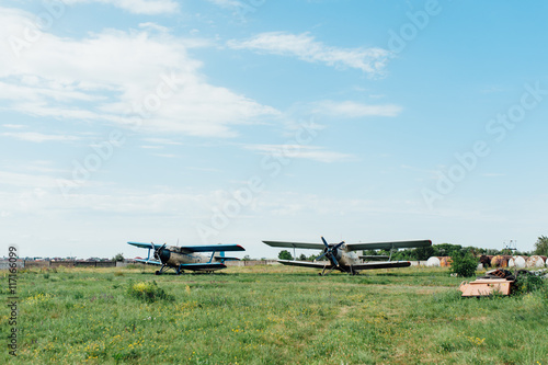 Airplanes standing on green grass. Ukraine, 2016