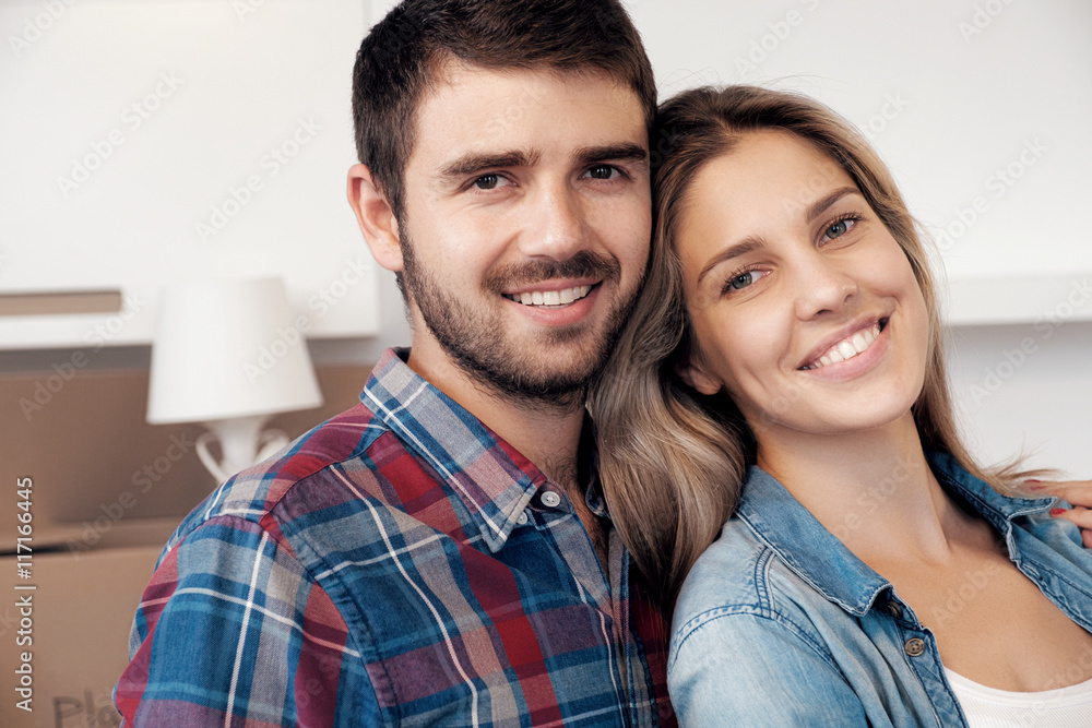 Young married couple smiling at camera Young married couple smiling at camera