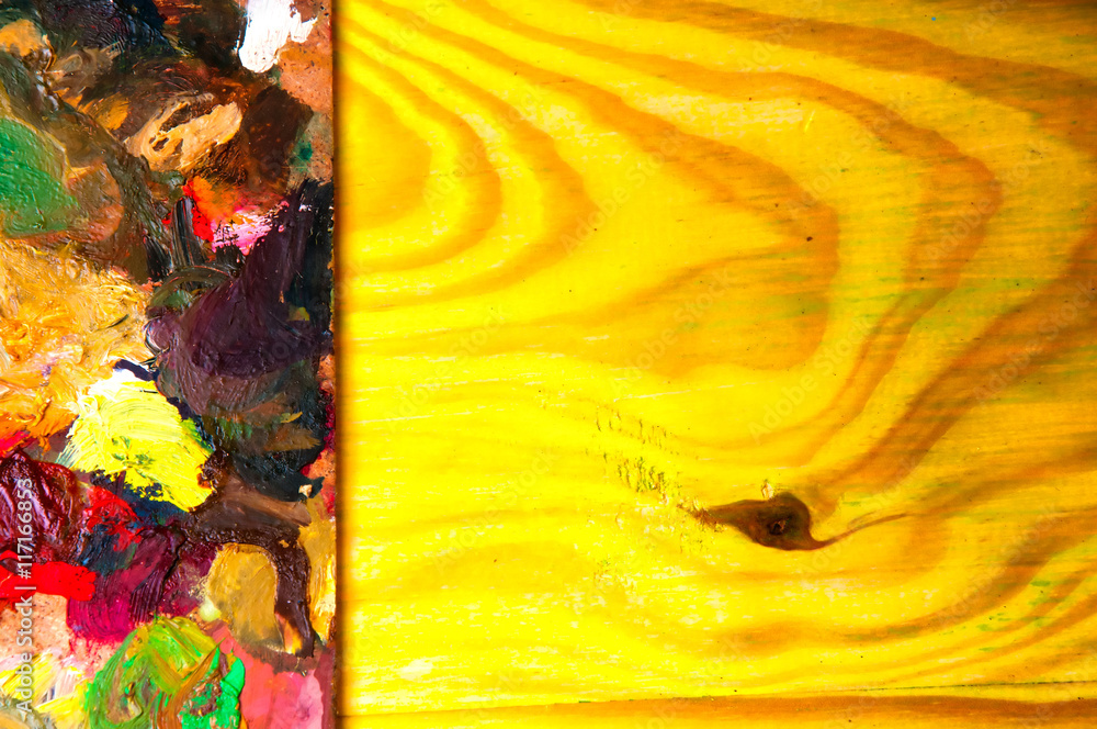 Fototapeta premium Painting palette on colored wooden background