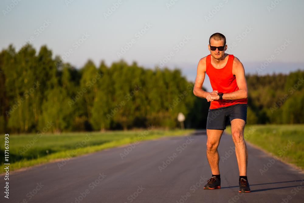Man running on country road training