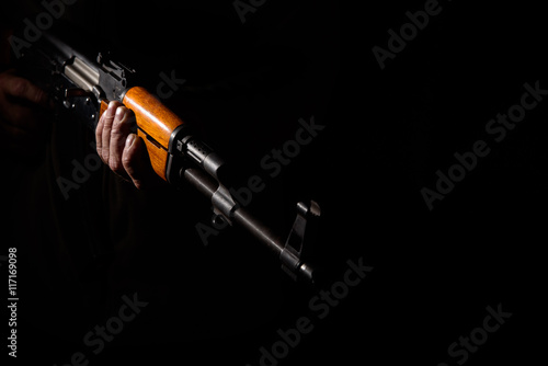 Photos Kalashnikov assault rifle close-up in the dark