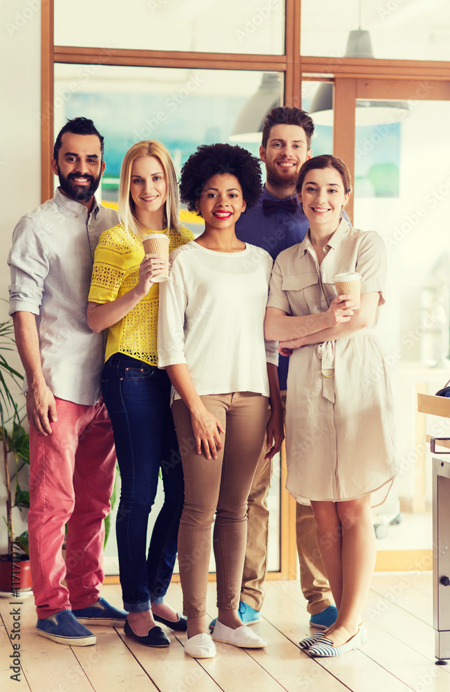happy smiling creative team with coffee in office happy smiling creative team with coffee in office