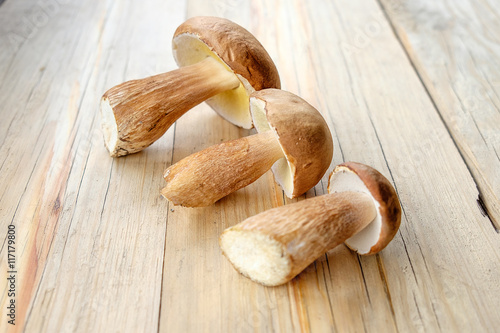 Harvested wild porcini mushrooms on wooden background