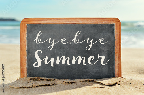 Tableau sur toile text bye, bye summer in a chalkboard on the beach