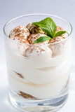 dessert with whipped cream in a transparent glass