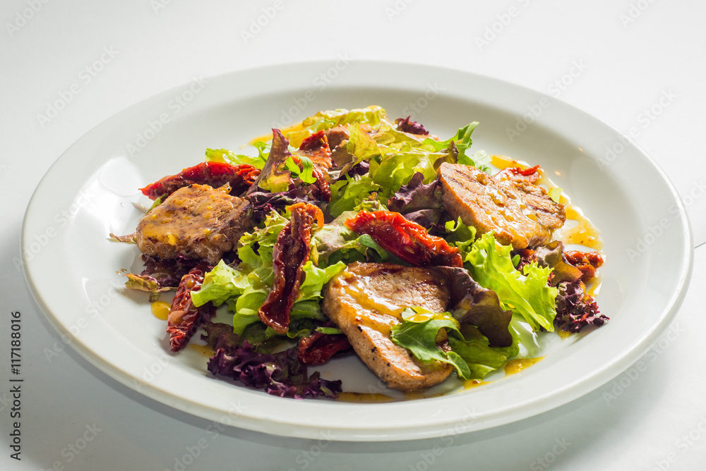 dish of salad with vegetables and meat