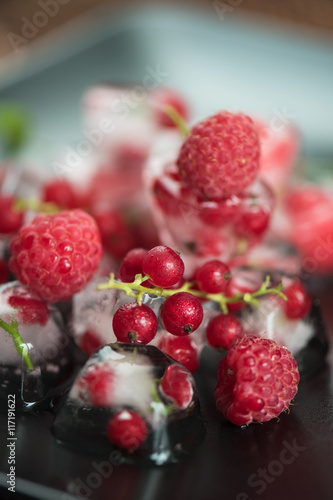 Frozen berries on wooden table